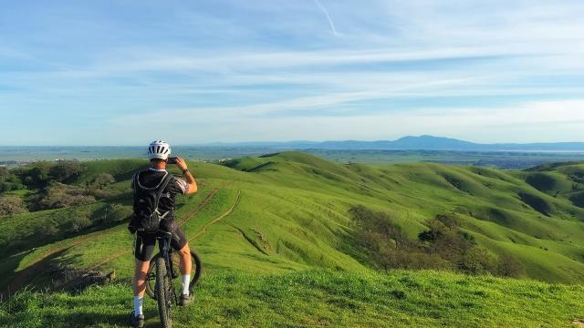 Mountain biker taking photo web Visit Vacaville